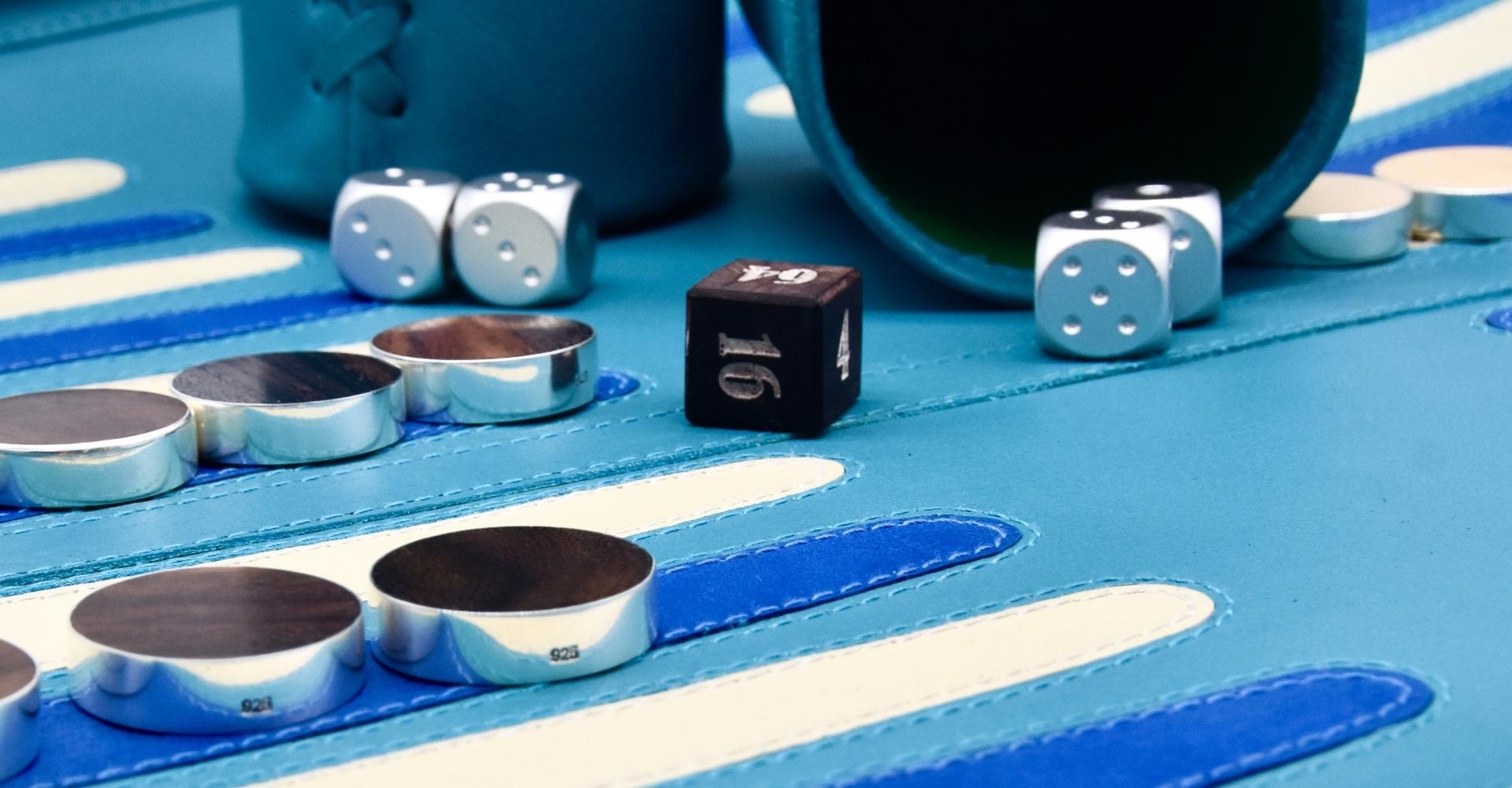 Stunning micro close-up of a luxury backgammon board featuring handcrafted sterling silver checkers. Discover premium custom backgammon sets at Bos Backgammon—where elegance and craftsmanship meet. Shop luxury backgammon boards designed for connoisseurs.